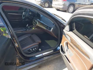 2018 BMW 5 Series M550i xDrive with VIN WBAJB9C55JB286747, listed as a IAAI auction lot 42583106 with 141,102 mi miles and . Bid and sale history available at DreamBid. Image 5.