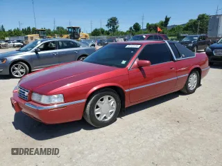 2002 Cadillac Eldorado z VIN 1G6EL12Y92B104731, wystawiony jako Copart lot #58722234 z przebiegiem 145 685 mil mil oraz Czysty tytuł • Clean title. Historia ofert i sprzedaży dostępna na DreamBid. Obrazek 1.