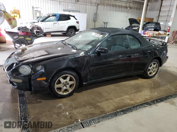 1997 Toyota Celica GT z VIN JT5FG02T3V0041206, wystawiony jako Copart lot #54601725 z przebiegiem 198 685 mil mil oraz Szkody całkowita. Historia ofert i sprzedaży dostępna na DreamBid. Obrazek 1.