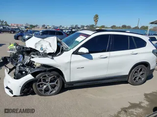 2016 BMW X1 xDrive28i with VIN WBXHT3C32G5E51855, listed as a IAAI auction lot 41634237 with 69,101 mi miles. Bid and sale history available at carsss.com. Image 13.