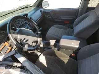 1997 Jeep Grand Cherokee Laredo with VIN 1J4GZ58S5VC561060, listed as a Copart auction lot 52098315 with 267,245 mi miles and Salvage title. Bid and sale history available at DreamBid. Image 7.