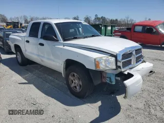 2007 Dodge Dakota SLT z VIN 1D7HE48P77S164721, wystawiony jako Copart lot #49673685 z przebiegiem 218 861 mil mil oraz Szkody całkowita. Historia ofert i sprzedaży dostępna na DreamBid. Obrazek 4.