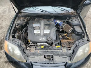 2003 Hyundai Tiburon GT z VIN KMHHN65F83U101784, wystawiony jako Copart lot #41566805 z przebiegiem 99 970 mil mil oraz Nie do naprawy • Non repairable. Historia ofert i sprzedaży dostępna na DreamBid. Obrazek 11.