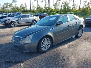 2011 Cadillac CTS Luxury with VIN 1G6DE5EY5B0154563, listed as a IAAI auction lot 36806985 with 92,635 mi miles and . Bid and sale history available at DreamBid. Image 2.