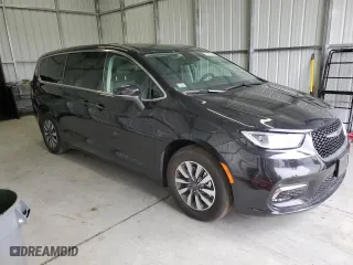 2023 Chrysler Pacifica Hybrid Touring L with VIN 2C4RC1L74PR575358, listed as a Copart auction lot 43261875 with 35,077 mi miles and Clean Title. Bid and sale history available at carsss.com. Image 4.