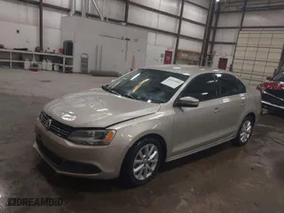 2014 Volkswagen Jetta Sedan SE with VIN 3VWD17AJ9EM241667, listed as a IAAI auction lot 41657090 with 114,641 mi miles. Bid and sale history available at carsss.com. Image 2.