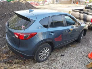 2016 Mazda CX-5 Touring with VIN JM3KE4CY5G0771252, listed as a IAAI auction lot 42138637 with 106,767 mi miles and . Bid and sale history available at carsss.com. Image 4.