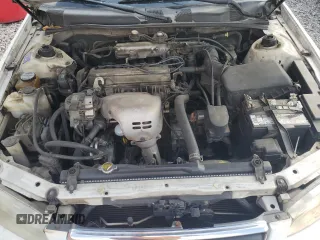 2000 Toyota Camry CE z VIN 4T1BG22K5YU936033, wystawiony jako Copart lot #57636215 z przebiegiem 242 889 mil mil oraz Szkoda całkowita • Salvage title. Historia ofert i sprzedaży dostępna na DreamBid. Obrazek 11.