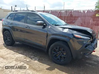 2014 Jeep Cherokee Trailhawk with VIN 1C4PJMBS6EW278648, listed as a IAAI auction lot 42433381 with 136,702 mi miles and . Bid and sale history available at DreamBid. Image 1.