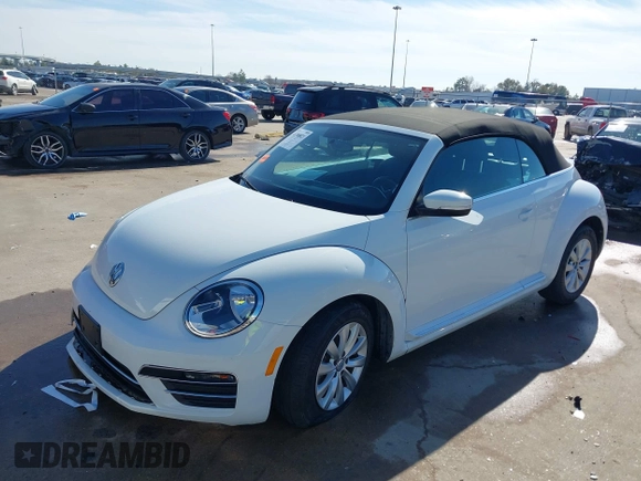 2019 Volkswagen Beetle S with VIN 3VW5DAAT0KM507437, listed as a IAAI auction lot 41380821 with 28,010 mi miles and . Bid and sale history available at DreamBid. Image 2.