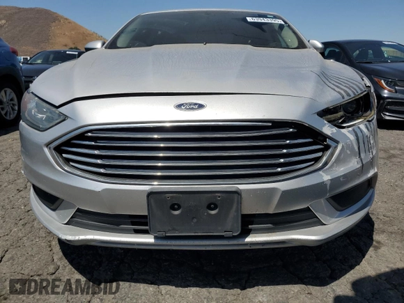 2017 Ford Fusion Hybrid SE z VIN 3FA6P0LU9HR306927, wystawiony jako Copart lot #63943395 z przebiegiem 157 851 mil mil oraz Czysty tytuł • Clean title. Historia ofert i sprzedaży dostępna na DreamBid. Obrazek 5.