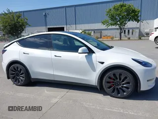 2022 Tesla Model Y Performance z VIN 7SAYGDEF2NF347456, wystawiony jako IAAI lot #42177725 z przebiegiem 29 374 mil mil oraz . Historia ofert i sprzedaży dostępna na DreamBid. Obrazek 14.