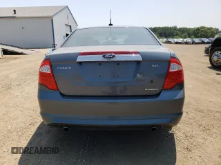 2012 Ford Fusion SEL z VIN 3FAHP0JG7CR332022, wystawiony jako Copart lot #60785765 z przebiegiem 112 202 mil mil oraz Szkoda całkowita • Salvage title. Historia ofert i sprzedaży dostępna na DreamBid. Obrazek 6.