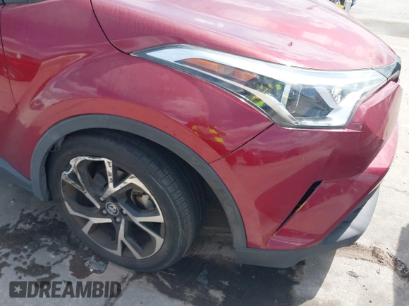 2019 Toyota C-HR XLE with VIN JTNKHMBX0K1017215, listed as a IAAI auction lot 41898189 with 74,239 mi miles. Bid and sale history available at carsss.com. Image 6.