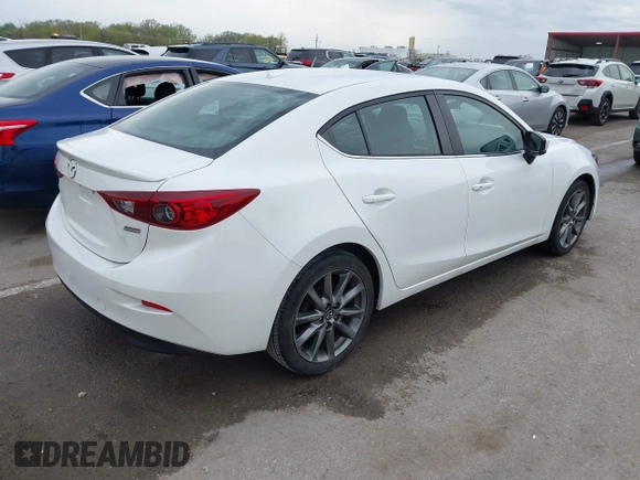 2018 Mazda 3 Touring with VIN 3MZBN1V32JM190611, listed as a IAAI auction lot 42032844 with 63,493 mi miles and . Bid and sale history available at DreamBid. Image 4.