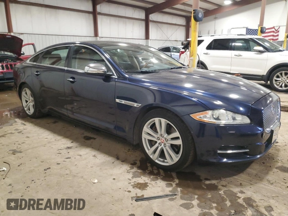 2014 Jaguar XJ Portfolio with VIN SAJWJ2GD7E8V67473, listed as a Copart auction lot 43968705 with 99,146 mi miles and Salvage title. Bid and sale history available at DreamBid. Image 4.