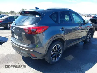 2016 Mazda CX-5 Grand Touring with VIN JM3KE2DY9G0824196, listed as a IAAI auction lot 41801887 with 88,625 mi miles. Bid and sale history available at carsss.com. Image 4.