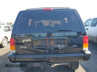 1998 Jeep Cherokee Sport with VIN 1J4FT68S8WL134461, listed as a Copart auction lot 74005704 with 0 mi miles and Salvage Title. Bid and sale history available at carsss.com. Image 6.