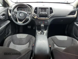 2016 Jeep Cherokee Sport with VIN 1C4PJLAB0GW106601, listed as a Copart auction lot 60854675 with 58,557 mi miles and Salvage title. Bid and sale history available at DreamBid. Image 8.