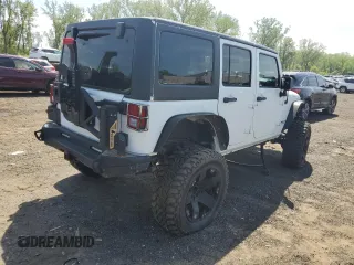 2013 Jeep Wrangler Unlimited Rubicon with VIN 1C4HJWFG2DL549064, listed as a Copart auction lot 56474055 with 148,217 mi miles and Salvage title. Bid and sale history available at DreamBid. Image 3.