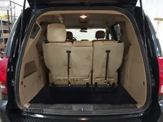 2014 Dodge Grand Caravan SXT with VIN 2C4RDGCGXER154709, listed as a IAAI auction lot 41117603 with 214,872 mi miles and . Bid and sale history available at DreamBid. Image 16.