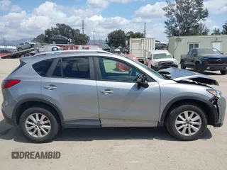 2014 Mazda CX-5 Touring z VIN JM3KE2CYXE0322943, wystawiony jako IAAI lot #41934670 z przebiegiem 110 690 mil mil oraz . Historia ofert i sprzedaży dostępna na DreamBid. Obrazek 13.