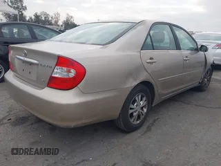 2004 Toyota Camry LE with VIN 4T1BF32K44U069081, listed as a IAAI auction lot 41460767 with 204,992 mi miles and . Bid and sale history available at carsss.com. Image 4.