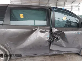 2014 Toyota Sienna L with VIN 5TDZK3DC5ES475204, listed as a IAAI auction lot 41277584 with 125,735 mi miles. Bid and sale history available at carsss.com. Image 12.