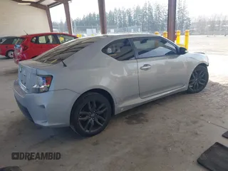2014 Scion tC with VIN JTKJF5C71E3069593, listed as a IAAI auction lot 41901040 with 86,231 mi miles. Bid and sale history available at carsss.com. Image 4.