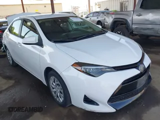 2018 Toyota Corolla L z VIN 5YFBURHE9JP815287, wystawiony jako IAAI lot #42079031 z przebiegiem 152 935 mil mil oraz . Historia ofert i sprzedaży dostępna na DreamBid. Obrazek 1.
