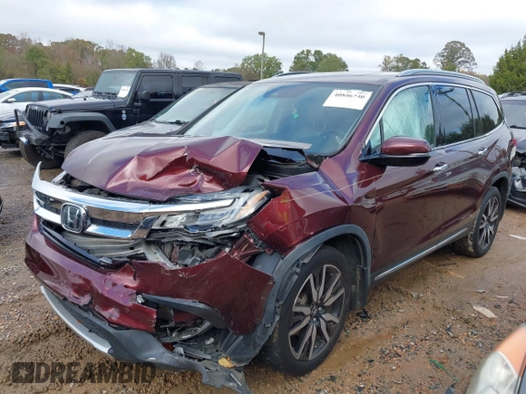 2020 Honda Pilot Touring 8-Passenger with VIN 5FNYF5H94LB012062, listed as a IAAI auction lot 40806740 with 115,431 mi miles and . Bid and sale history available at DreamBid. Image 2.