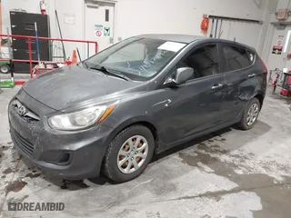 2013 Hyundai Accent GL with VIN KMHCT5AEXDU100208, listed as a IAAI auction lot 41517792 with 164,510 mi miles. Bid and sale history available at carsss.com. Image 2.
