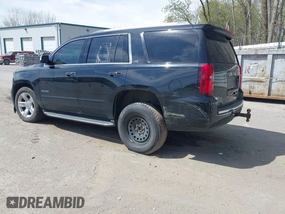 2015 Chevrolet Tahoe LTZ with VIN 1GNSKCKC8FR514671, listed as a IAAI auction lot 42157084 with 182,665 mi miles and . Bid and sale history available at DreamBid. Image 3.