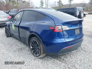 2021 Tesla Model Y Standard Range with VIN 5YJYGDED8MF122985, listed as a IAAI auction lot 41430423 with 120,302 mi miles and . Bid and sale history available at carsss.com. Image 3.