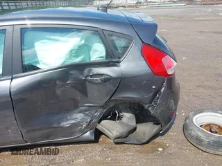 2019 Ford Fiesta SE z VIN 3FADP4EJ9KM125252, wystawiony jako IAAI lot #42221622 z przebiegiem 57 366 mil mil oraz . Historia ofert i sprzedaży dostępna na DreamBid. Obrazek 6.