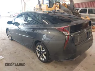 2017 Toyota Prius Two z VIN JTDKARFU7H3041322, wystawiony jako IAAI lot #42358306 z przebiegiem 98 735 mil mil oraz . Historia ofert i sprzedaży dostępna na DreamBid. Obrazek 3.