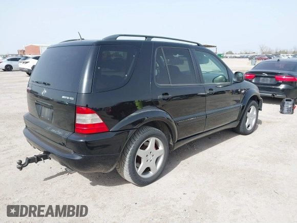 2001 Mercedes-Benz M-Class AMG with VIN 4JGAB74E51A272841, listed as a IAAI auction lot 41734340 with 168,387 mi miles. Bid and sale history available at carsss.com. Image 4.