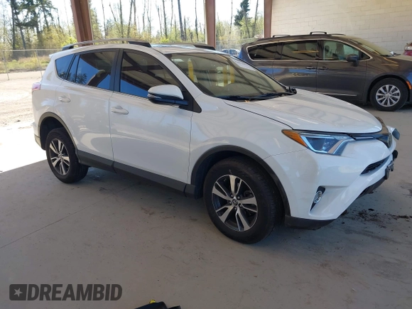 2018 Toyota RAV4 XLE with VIN JTMRFREVXJD240388, listed as a IAAI auction lot 42052065 with 117,114 mi miles. Bid and sale history available at carsss.com. Image 1.