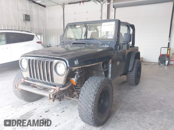 1999 Jeep Wrangler Sport with VIN 1J4FY19S4XP494405, listed as a IAAI auction lot 42542416 with 168,856 mi miles and . Bid and sale history available at DreamBid. Image 17.