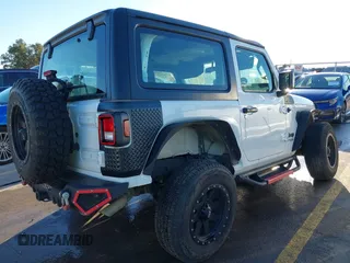 2021 Jeep Wrangler Sport S with VIN 1C4GJXAN2MW663880, listed as a IAAI auction lot 41059915 with 83,867 mi miles and . Bid and sale history available at DreamBid. Image 4.