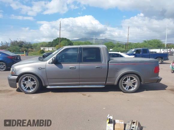 2002 Ford F-150 Harley Davidson with VIN 1FTRW07312KC88379, listed as a IAAI auction lot 41657219 with 1 mi miles. Bid and sale history available at carsss.com. Image 14.