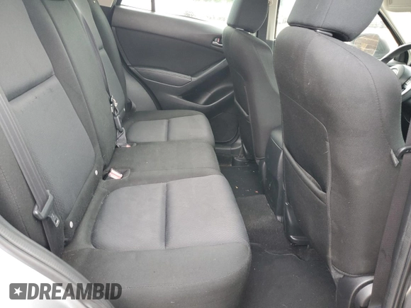 2015 Mazda CX-5 Sport z VIN JM3KE2BE4F0459532, wystawiony jako Copart lot #61049235 z przebiegiem 149 808 mil mil oraz Szkoda całkowita • Salvage title. Historia ofert i sprzedaży dostępna na DreamBid. Obrazek 11.