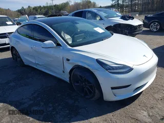 2020 Tesla Model 3 Standard Range Plus with VIN 5YJ3E1EA7LF797150, listed as a IAAI auction lot 41869088 with 75,708 mi miles and . Bid and sale history available at carsss.com. Image 1.