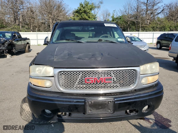 2004 GMC Yukon Denali with VIN 1GKEK63U74J212674, listed as a Copart auction lot 69704734 with 174,893 mi miles and Salvage Title. Bid and sale history available at carsss.com. Image 5.