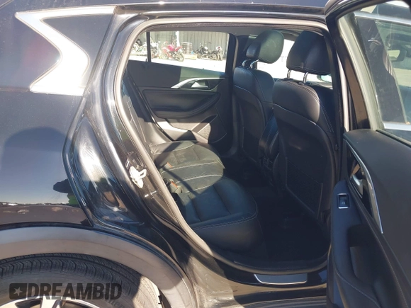2018 Infiniti QX30 Luxury with VIN SJKCH5CRXJA058994, listed as a IAAI auction lot 41389481 with 69,907 mi miles and . Bid and sale history available at DreamBid. Image 8.
