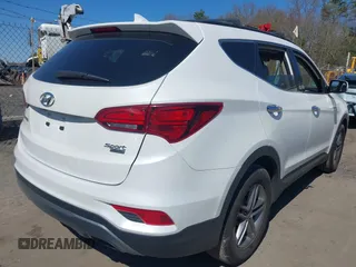 2017 Hyundai Santa Fe 2.4L z VIN 5NMZUDLB9HH028990, wystawiony jako IAAI lot #42055991 z przebiegiem 91 569 mil mil oraz . Historia ofert i sprzedaży dostępna na DreamBid. Obrazek 4.