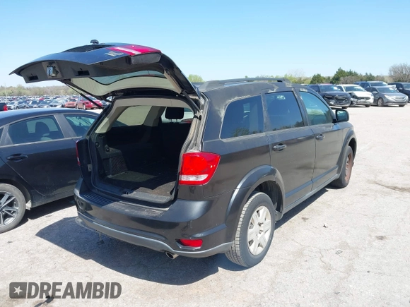2011 Dodge Journey Mainstreet with VIN 3D4PG1FG0BT527937, listed as a IAAI auction lot 42003997 with 209,894 mi miles and . Bid and sale history available at carsss.com. Image 4.