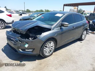 2018 Ford Focus Titanium with VIN 1FADP3N28JL232120, listed as a IAAI auction lot 42544070 with 28,661 mi miles and . Bid and sale history available at DreamBid. Image 2.