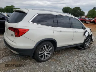 2017 Honda Pilot Touring z VIN 5FNYF6H92HB067140, wystawiony jako Copart lot #55757925 z przebiegiem 132 425 mil mil oraz Szkoda całkowita • Salvage title. Historia ofert i sprzedaży dostępna na DreamBid. Obrazek 3.