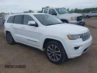 2017 Jeep Grand Cherokee Overland with VIN 1C4RJFCG6HC941771, listed as a IAAI auction lot 42356577 with 192,318 mi miles and . Bid and sale history available at DreamBid. Image 1.
